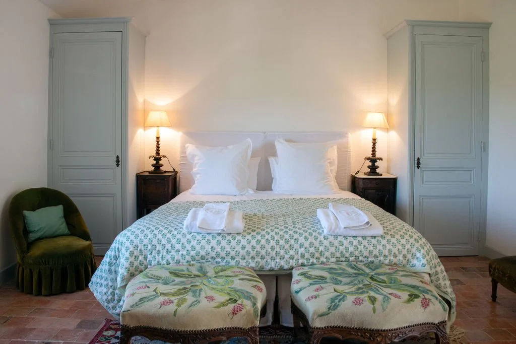 A bright twin guest room at Le Devencet