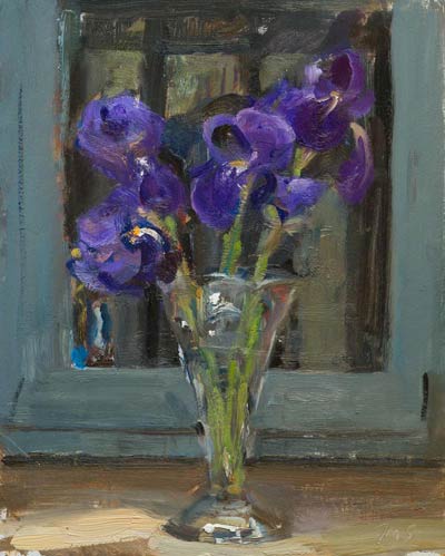 Vase of irises on a window sill